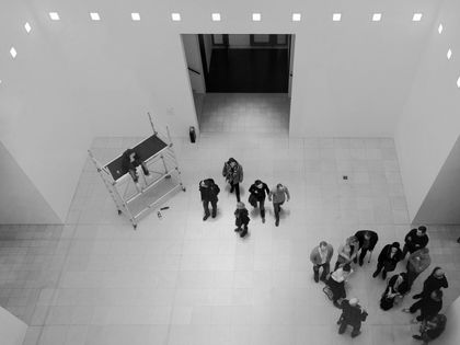 People waiting in an exhibition room