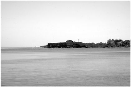 A peninsula with a church reaching out into the calm sea