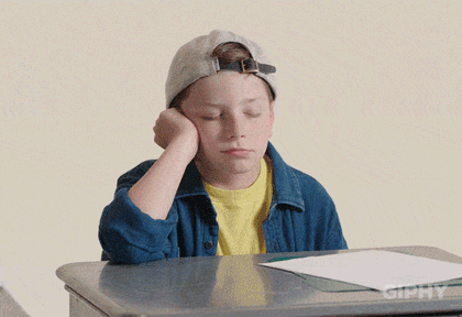A tired school kid on a desk